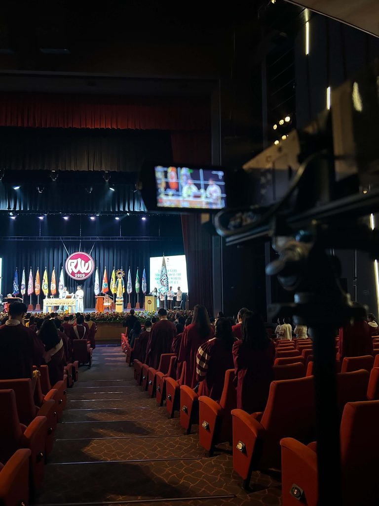 Camera operator and camera assistant volunteer in
PWU's 103rd Baccalaureate Mass and Commencement Exercises in media production